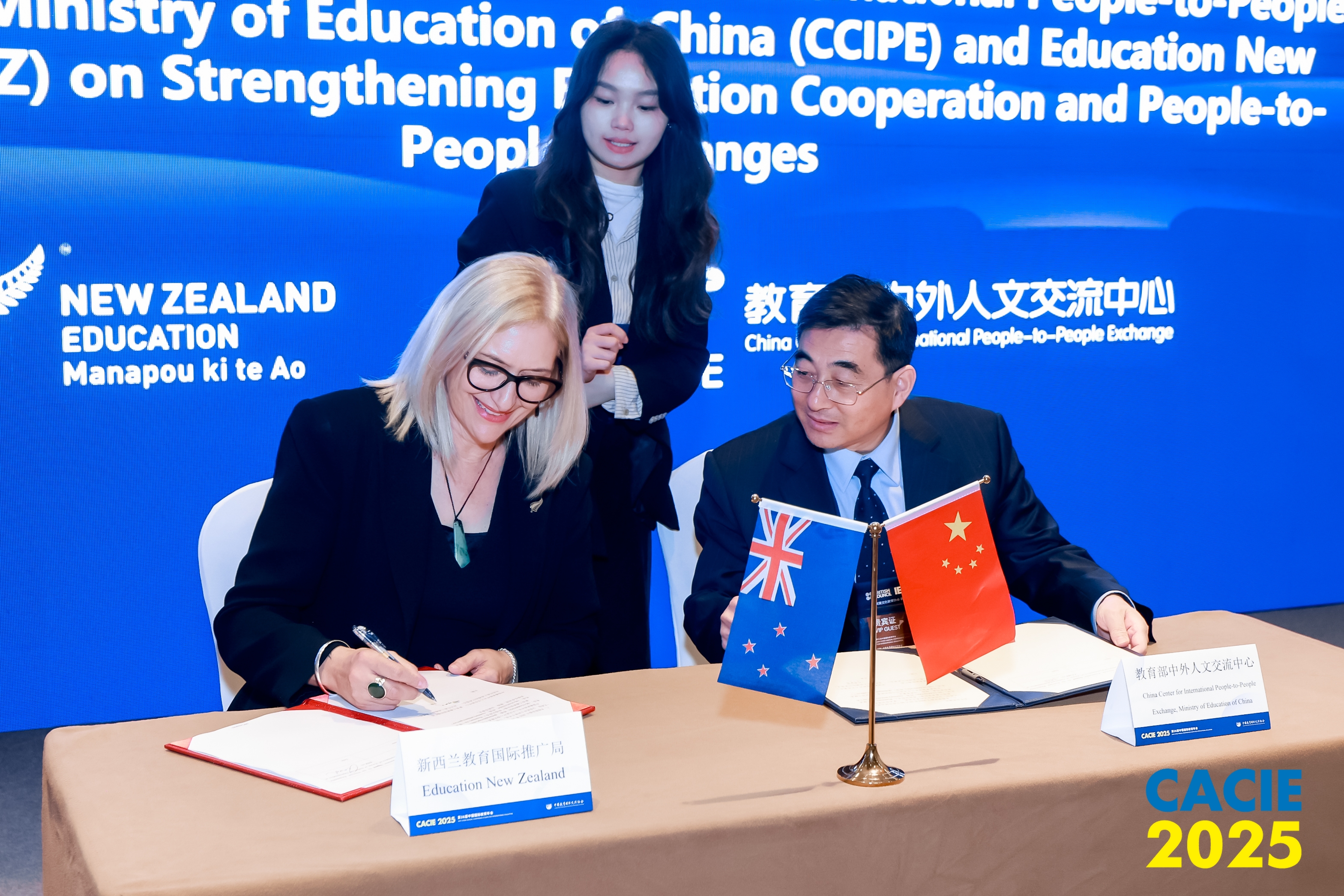 ENZ Chief Executive Amanda Malu signs a letter of intent with the China Center for International People to People Exchange Director General, Yu Changxue